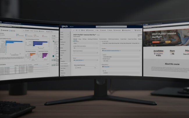 A curved monitor displays training data and details of a STOTT PILATES Intensive Mat-Plus course from YMCA, showcasing analytics and course info.